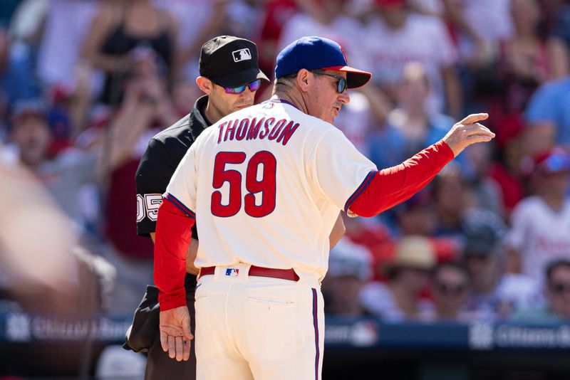 Aug 13, 2023; Philadelphia, Pennsylvania, USA; Philadelphia Phillies manager Rob Thomson (59) argues with umpire Alex Mackay a strikeout call on designated hitter Bryce Harper (not pictured) during the eighth inning against the Minnesota Twins at Citizens Bank Park. Mandatory Credit: Bill Streicher-USA TODAY Sportsa