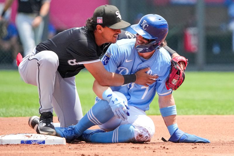 Jul 21, 2024; Kansas City, Missouri, USA; Chicago White Sox shortstop Nicky Lopez (8) embraces Kansas City Royals shortstop Bobby Witt Jr. (7) at second base after tagging him out in the first inning at Kauffman Stadium. Mandatory Credit: Denny Medley-USA TODAY Sports