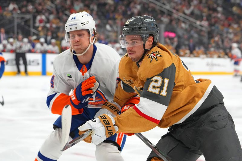 Nov 13, 2025; Las Vegas, Nevada, USA; Vegas Golden Knights center Brett Howden (21) skates against New York Islanders defenseman Adam Boqvist (34) during the first period at T-Mobile Arena. Mandatory Credit: Stephen R. Sylvanie-Imagn Images