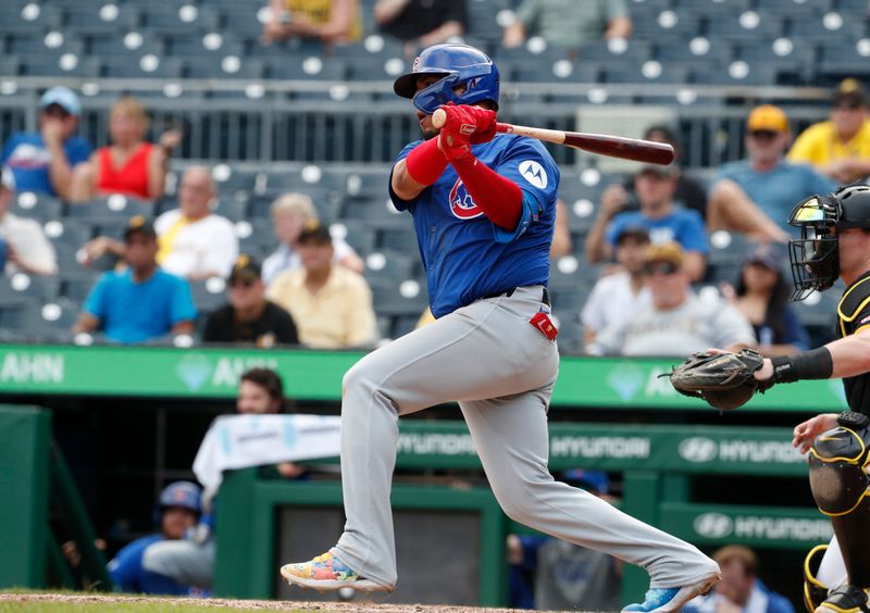 Aug 28, 2024; Pittsburgh, Pennsylvania, USA;  Chicago Cubs third baseman Isaac Paredes (17) hits a single against the Pittsburgh Pirates during the ninth inning at PNC Park. Chicago won 14-10. Mandatory Credit: Charles LeClaire-USA TODAY Sports