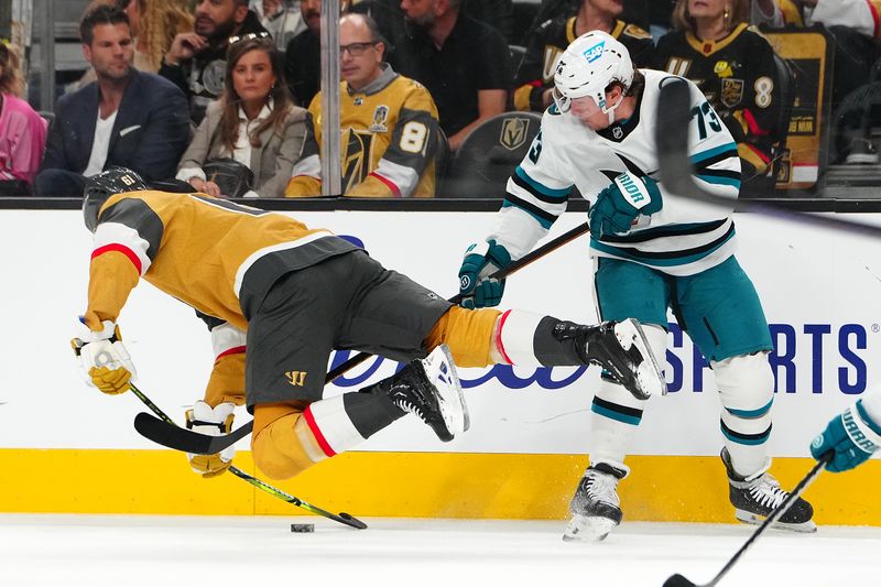 Oct 26, 2024; Las Vegas, Nevada, USA; San Jose Sharks center Tyler Toffoli (73) trips Vegas Golden Knights right wing Mark Stone (61) during the first period at T-Mobile Arena. Mandatory Credit: Stephen R. Sylvanie-Imagn Images