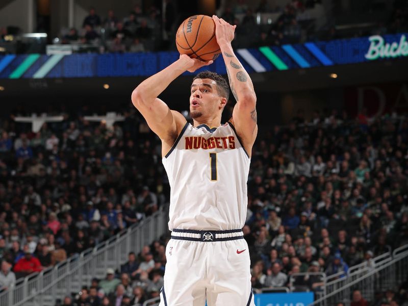 MILWAUKEE, WI - FEBRUARY 12: Michael Porter Jr. #1 of the Denver Nuggets three point basket during the game against the Milwaukee Bucks on February 12, 2024 at the Fiserv Forum Center in Milwaukee, Wisconsin. NOTE TO USER: User expressly acknowledges and agrees that, by downloading and or using this Photograph, user is consenting to the terms and conditions of the Getty Images License Agreement. Mandatory Copyright Notice: Copyright 2024 NBAE (Photo by Gary Dineen/NBAE via Getty Images).