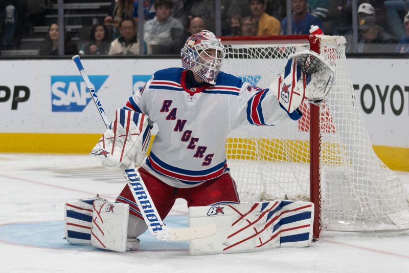 Jan 23, 2024; San Jose, California, USA; New York Rangers goaltender Igor Shesterkin (31) reaches for the puck during the second period against the San Jose Sharks at SAP Center at San Jose. Mandatory Credit: Stan Szeto-USA TODAY Sports