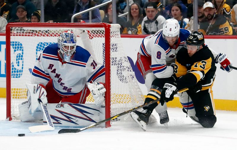 Oct 9, 2024; Pittsburgh, Pennsylvania, USA;  New York Rangers goaltender Igor Shesterkin (31) and defenseman Jacob Trouba (8) defend the net against Pittsburgh Penguins right wing Kevin Hayes (13) during the first period at PPG Paints Arena. Mandatory Credit: Charles LeClaire-Imagn Images