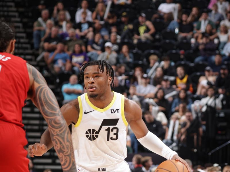 SALT LAKE CITY, UT - OCTOBER 7: Isaiah Collier #13 of the Utah Jazz handles the ball during the game against the Houston Rockets during a NBA preseason game on October 7, 2024 at the Delta Center in Salt Lake City, Utah. NOTE TO USER: User expressly acknowledges and agrees that, by downloading and or using this Photograph, User is consenting to the terms and conditions of the Getty Images License Agreement. Mandatory Copyright Notice: Copyright 2024 NBAE (Photo by Melissa Majchrzak/NBAE via Getty Images)