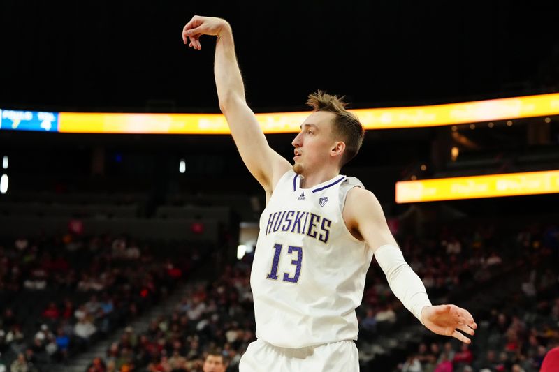 Mar 13, 2024; Las Vegas, NV, USA; Washington Huskies forward Moses Wood (13) shoots against the USC Trojans during the first half at T-Mobile Arena. Mandatory Credit: Stephen R. Sylvanie-USA TODAY Sports