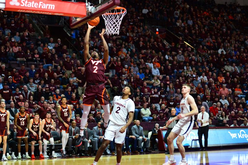 Feb 19, 2024; Blacksburg, Virginia, USA; Virginia Tech Hokies guard MJ Collins (2) shoots a shot as Virginia Cavaliers guard Reece Beekman (2) defends during the second half at Cassell Coliseum. Mandatory Credit: Brian Bishop-USA TODAY Sports