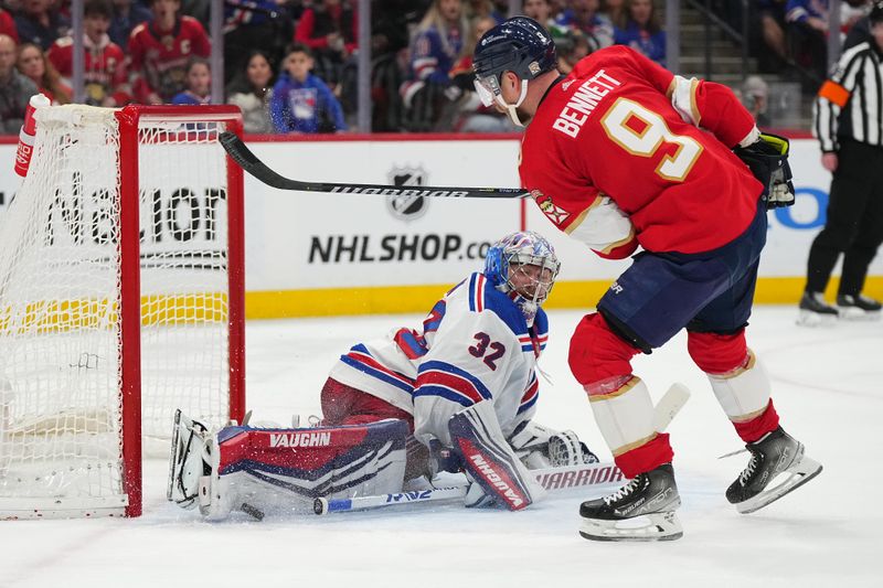 Dec 29, 2023; Sunrise, Florida, USA; New York Rangers goaltender Jonathan Quick (32) blocks the shot of Florida Panthers center Sam Bennett (9) during the second period at Amerant Bank Arena. Mandatory Credit: Jasen Vinlove-USA TODAY Sports