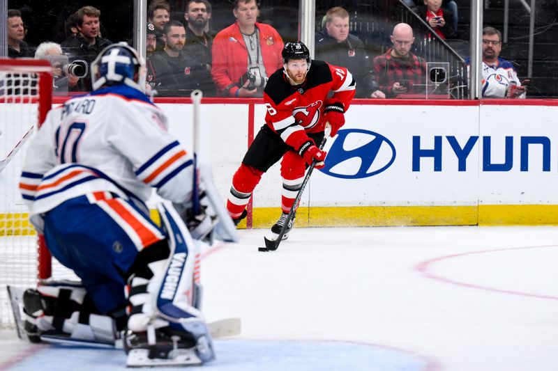 Oct 18, 2025; Newark, New Jersey, USA; New Jersey Devils right wing Connor Brown (16) skates with the puck as Edmonton Oilers goaltender Calvin Pickard (30) defends the net during the second period at Prudential Center. Mandatory Credit: John Jones-Imagn Images