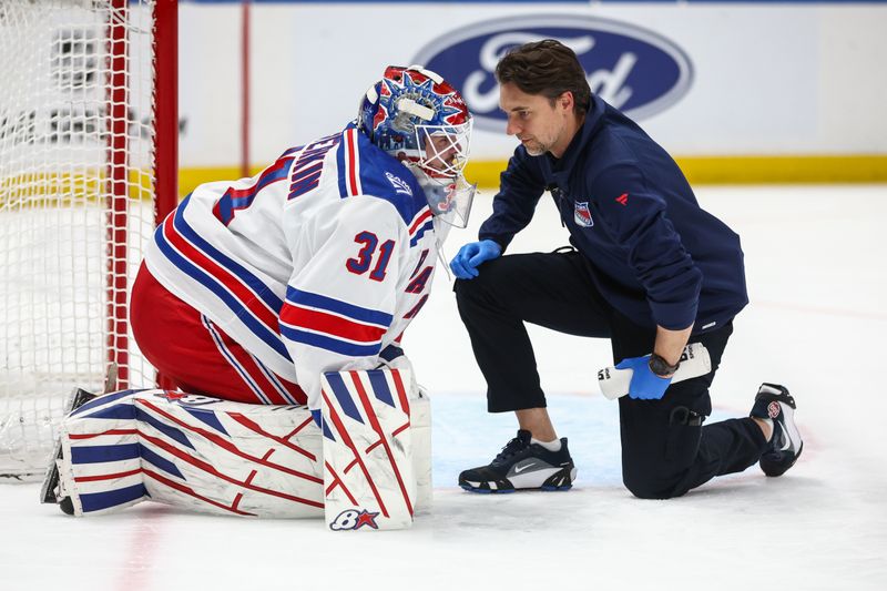 Dec 27, 2025; Elmont, New York, USA;  New York Rangers goaltender Igor Shesterkin (31) is checked on after getting injured in the second period against the New York Islanders at UBS Arena. Mandatory Credit: Wendell Cruz-Imagn Images