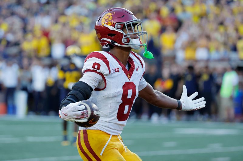 Sep 21, 2024; Ann Arbor, Michigan, USA;  USC Trojans wide receiver Ja'Kobi Lane (8) celebrates a touchdown in the second half against the Michigan Wolverines at Michigan Stadium. Mandatory Credit: Rick Osentoski-Imagn Images