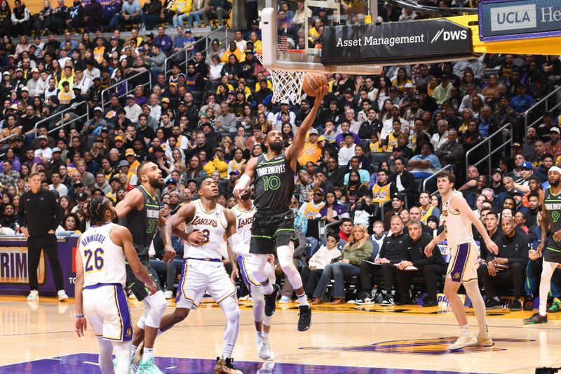 LOS ANGELES, CA - APRIL 7: Mike Conley #10 of the Minnesota Timberwolves drives to the basket during the game against the Los Angeles Lakers on April 7, 2024 at Crypto.Com Arena in Los Angeles, California. NOTE TO USER: User expressly acknowledges and agrees that, by downloading and/or using this Photograph, user is consenting to the terms and conditions of the Getty Images License Agreement. Mandatory Copyright Notice: Copyright 2024 NBAE (Photo by Juan Ocampo/NBAE via Getty Images)