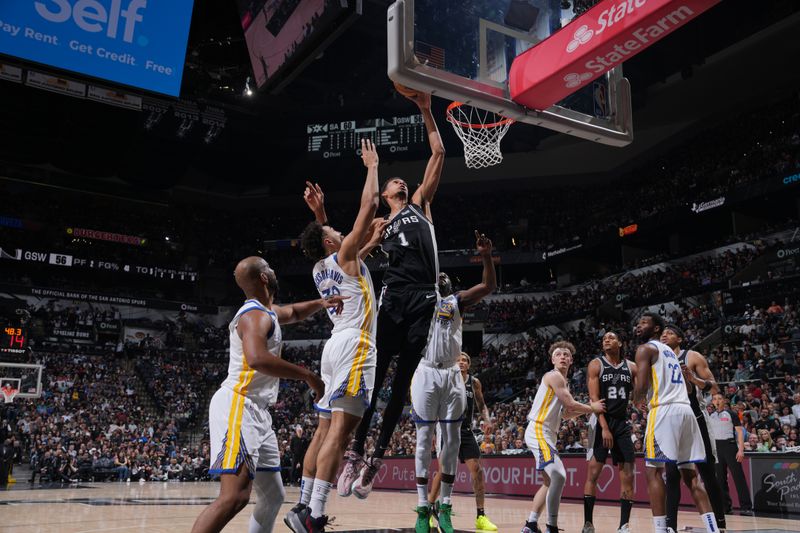 SAN ANTONIO, TX - MARCH 11: Victor Wembanyama #1 of the San Antonio Spurs drives to the basket during the game against the Golden State Warriors on March 11, 2024 at the AT&T Center in San Antonio, Texas. NOTE TO USER: User expressly acknowledges and agrees that, by downloading and or using this photograph, user is consenting to the terms and conditions of the Getty Images License Agreement. Mandatory Copyright Notice: Copyright 2024 NBAE (Photos by Jesse D. Garrabrant/NBAE via Getty Images)