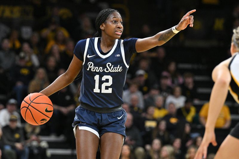 Feb 8, 2024; Iowa City, Iowa, USA; Penn State Nittany Lions guard Jayla Oden (12) controls the ball during the first half against the Iowa Hawkeyes at Carver-Hawkeye Arena. Mandatory Credit: Jeffrey Becker-USA TODAY Sports