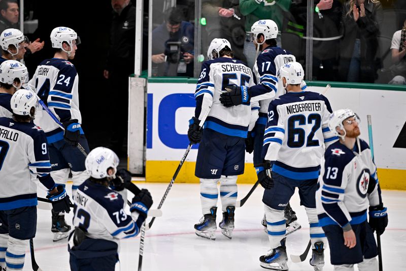 May 17, 2025; Dallas, Texas, USA; Winnipeg Jets center Mark Scheifele (55) skates off the ice with his teammates after the Dallas Stars defeat the Jets in the overtime period in game six of the second round of the 2025 Stanley Cup Playoffs at American Airlines Center. Mandatory Credit: Jerome Miron-Imagn Images