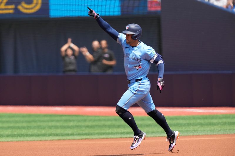 Jul 21, 2024; Toronto, Ontario, CAN; Toronto Blue Jays right fielder George Springer (4) celebrates his solo home run against the Detroit Tigers as he runs the bases during the first inning at Rogers Centre. Mandatory Credit: John E. Sokolowski-USA TODAY Sports