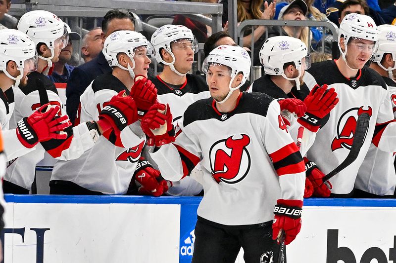 Nov 3, 2023; St. Louis, Missouri, USA;  New Jersey Devils center Curtis Lazar (42) is congratulated by teammates after scoring against the St. Louis Blues during the second period at Enterprise Center. Mandatory Credit: Jeff Curry-USA TODAY Sports