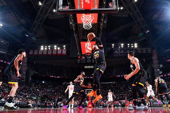 HOUSTON, TX - DECEMBER 27:   Jusuf Nurkic #20 of the Phoenix Suns grabs a rebound during the game against the Houston Rockets on December 27, 2023 at the Toyota Center in Houston, Texas. NOTE TO USER: User expressly acknowledges and agrees that, by downloading and or using this photograph, User is consenting to the terms and conditions of the Getty Images License Agreement. Mandatory Copyright Notice: Copyright 2023 NBAE (Photo by Logan Riely/NBAE via Getty Images)