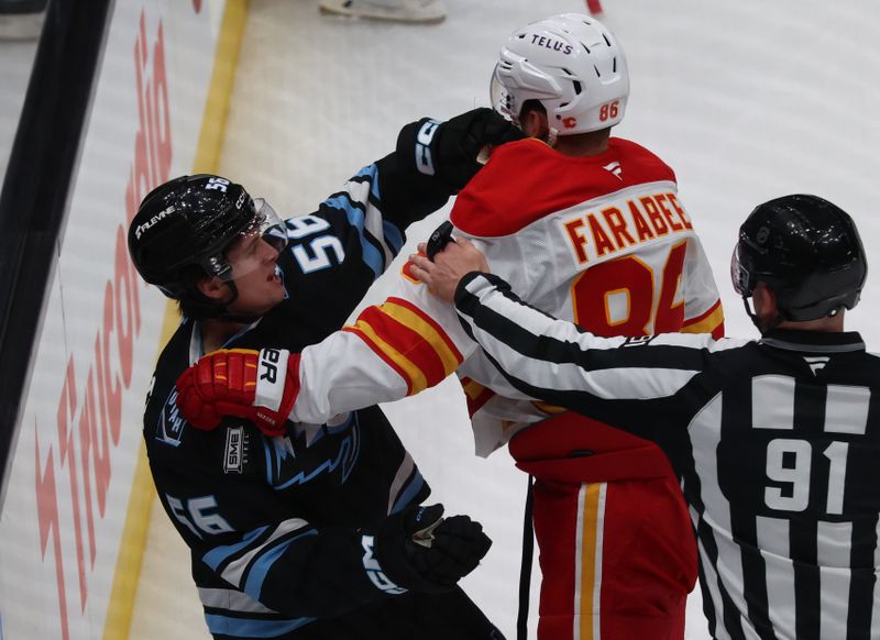 Oct 15, 2025; Salt Lake City, Utah, USA; Utah Mammoth right wing Kailer Yamamoto (56) and Calgary Flames left wing Joel Farabee (86) fight during the second period at Delta Center. Mandatory Credit: Rob Gray-Imagn Images