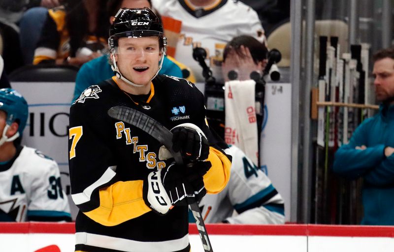 Mar 14, 2024; Pittsburgh, Pennsylvania, USA; Pittsburgh Penguins defenseman John Ludvig (7) reacts after scoring a goal against the San Jose Sharks during the third period at PPG Paints Arena. Pittsburgh won 6-3. Mandatory Credit: Charles LeClaire-USA TODAY Sports