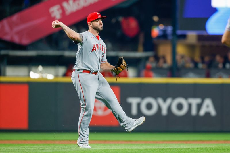 Sep 12, 2023; Seattle, Washington, USA; Los Angeles Angels third baseman Mike Moustakas (8) attempts a throw to first base against the Seattle Mariners during the first inning at T-Mobile Park. Mandatory Credit: Joe Nicholson-USA TODAY Sports