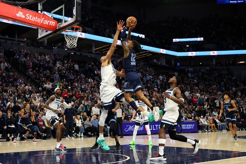 MINNEAPOLIS, MINNESOTA - JANUARY 11: Ja Morant #12 of the Memphis Grizzlies goes up for a shot against Rudy Gobert #27 of the Minnesota Timberwolves in the fourth quarter at Target Center on January 11, 2025 in Minneapolis, Minnesota. The Grizzlies defeated the Timberwolves 127-125. NOTE TO USER: User expressly acknowledges and agrees that, by downloading and or using this photograph, User is consenting to the terms and conditions of the Getty Images License Agreement. (Photo by David Berding/Getty Images)