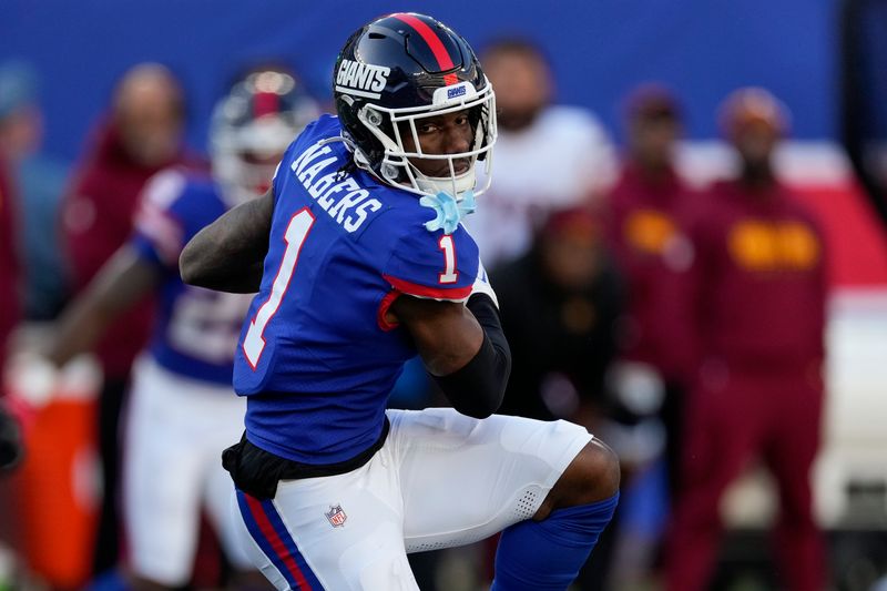 New York Giants wide receiver Malik Nabers (1) makes a catch against the Washington Commanders during the second half of an NFL football game, Sunday, Nov. 3, 2024, in East Rutherford, N.J. (AP Photo/Seth Wenig)