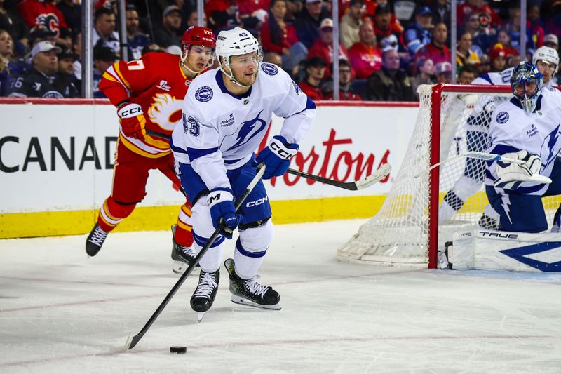 Mar 22, 2026; Calgary, Alberta, CAN; Tampa Bay Lightning defenseman Darren Raddysh (43) skates with the puck against the Calgary Flames during the second period at Scotiabank Saddledome. Mandatory Credit: Sergei Belski-Imagn Images