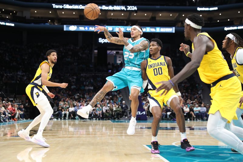 CHARLOTTE, NC - NOVEMBER 8: Tre Mann #23 of the Charlotte Hornets passes the ball during the game against the Indiana Pacers on November 8, 2024 at Spectrum Center in Charlotte, North Carolina. NOTE TO USER: User expressly acknowledges and agrees that, by downloading and or using this photograph, User is consenting to the terms and conditions of the Getty Images License Agreement. Mandatory Copyright Notice: Copyright 2024 NBAE (Photo by Brock Williams-Smith/NBAE via Getty Images)