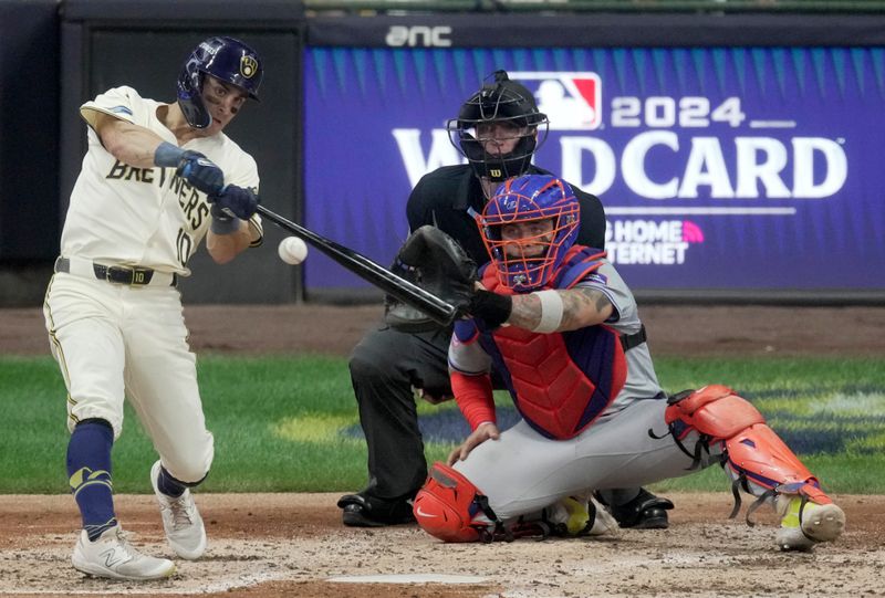 Oct 1, 2024; Milwaukee, Wisconsin, USA; Milwaukee Brewers outfielder Sal Frelick (10) hits a double during the fourth inning of their wild-card playoff game against the New York Mets at American Family Field. Mandatory Credit: Mark Hoffman/USA TODAY Network via Imagn Images