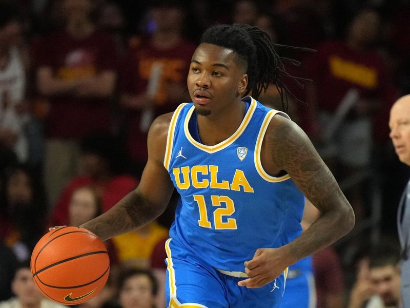 Jan 27, 2024; Los Angeles, California, USA; UCLA Bruins guard Sebastian Mack (12) dribbles the ball against the Southern California Trojans in the first half at Galen Center. Mandatory Credit: Kirby Lee-USA TODAY Sports