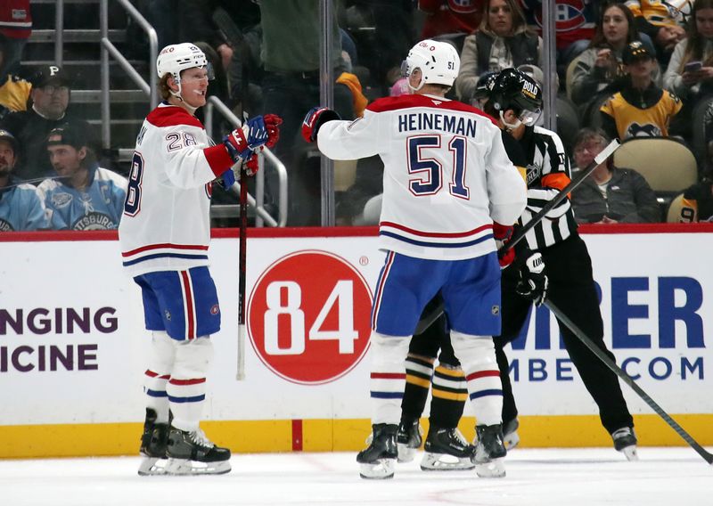 Nov 2, 2024; Pittsburgh, Pennsylvania, USA;  Montreal Canadiens left wing Emil Heineman (51) congratulates center Christian Dvorak (28) on his goal against the Pittsburgh Penguins during the third period at PPG Paints Arena. Mandatory Credit: Charles LeClaire-Imagn Images