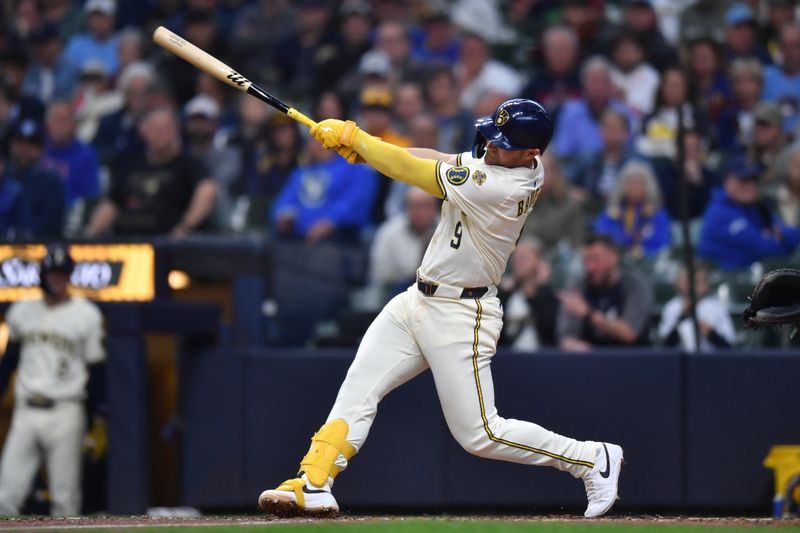 May 28, 2025; Milwaukee, Wisconsin, USA; Milwaukee Brewers first baseman Jake Bauers (9) hits a home run during the third inning against the Boston Red Sox at American Family Field. Mandatory Credit: Patrick Gorski-Imagn Images
