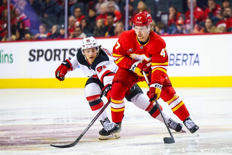 Nov 1, 2024; Calgary, Alberta, CAN; Calgary Flames center Connor Zary (47) controls the puck against New Jersey Devils center Dawson Mercer (91) during the third period at Scotiabank Saddledome. Mandatory Credit: Sergei Belski-Imagn Images