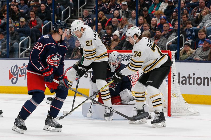 Jan 2, 2024; Columbus, Ohio, USA; Boston Bruins left wing James van Riemsdyk (21) screens Columbus Blue Jackets goalie Spencer Martin (30) during the second period at Nationwide Arena. Mandatory Credit: Russell LaBounty-USA TODAY Sports