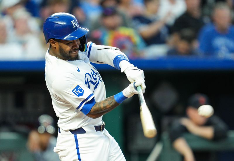 May 20, 2024; Kansas City, Missouri, USA; Kansas City Royals third baseman Maikel Garcia (11) hits an RBI single during the sixth inning against the Detroit Tigers at Kauffman Stadium. Mandatory Credit: Jay Biggerstaff-USA TODAY Sports