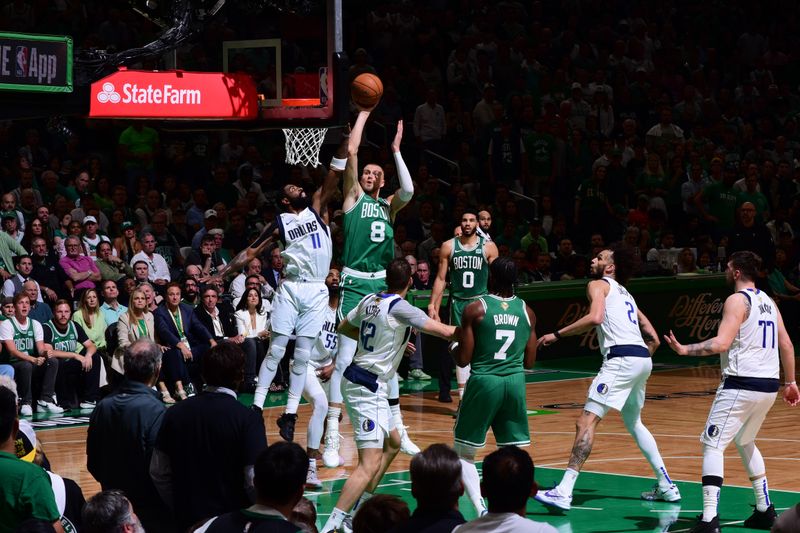 BOSTON, MA - JUNE 17: Kristaps Porzingis #8 of the Boston Celtics shoots the ball during the game against the Dallas Mavericks during Game 5 of the 2024 NBA Finals on June 17, 2024 at the TD Garden in Boston, Massachusetts. NOTE TO USER: User expressly acknowledges and agrees that, by downloading and or using this photograph, User is consenting to the terms and conditions of the Getty Images License Agreement. Mandatory Copyright Notice: Copyright 2024 NBAE  (Photo by Garrett Ellwood/NBAE via Getty Images)