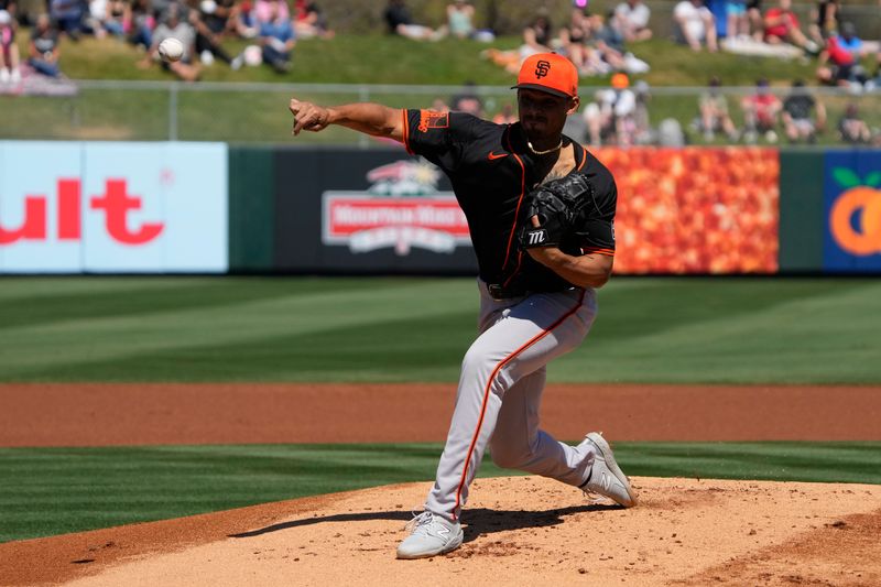 Mar 20, 2024; Tempe, Arizona, USA; San Francisco Giants starting pitcher Jordan Hicks (12) throws a pitch against the Los Angeles Angels in the first inning at Tempe Diablo Stadium. Mandatory Credit: Rick Scuteri-USA TODAY Sports