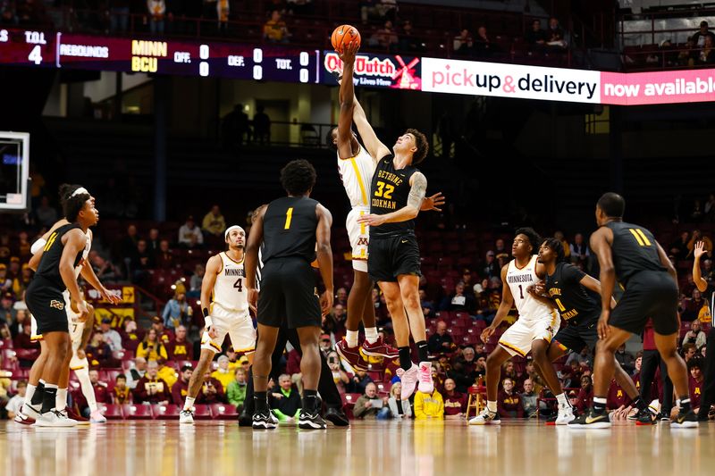 Nov 6, 2023; Minneapolis, Minnesota, USA; Minnesota Golden Gophers forward Pharrel Payne (21) and Bethune-Cookman Wildcats center Elijah Hulsewe (32) jump for the opening tip off during the first half at Williams Arena. Mandatory Credit: Matt Krohn-USA TODAY Sports