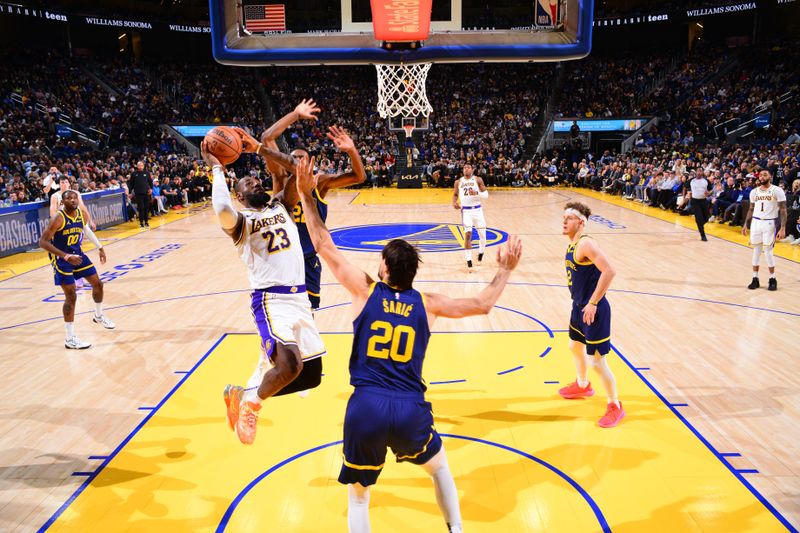 SAN FRANCISCO, CA - JANUARY 27:  LeBron James #23 of the Los Angeles Lakers drives to the basket during the game against the Golden State Warriors on January 27, 2024 at Chase Center in San Francisco, California. NOTE TO USER: User expressly acknowledges and agrees that, by downloading and or using this photograph, user is consenting to the terms and conditions of Getty Images License Agreement. Mandatory Copyright Notice: Copyright 2024 NBAE (Photo by Barry Gossage/NBAE via Getty Images)