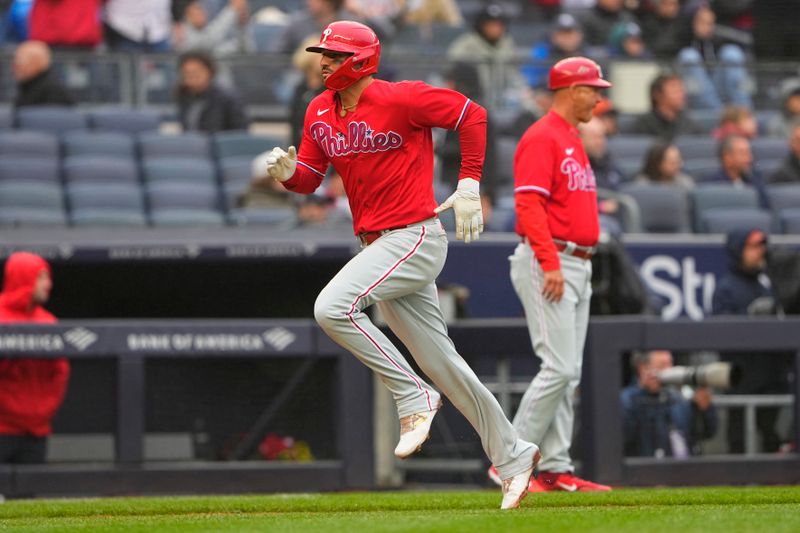 Apr 5, 2023; Bronx, New York, USA; Philadelphia Phillies designated hitter Nick Castellanos (8) scores a run on Philadelphia Phillies right fielder Jake Cave (44) (not pictured) sacrifice fly ball against the New York Yankees during the seventh inning at Yankee Stadium. Mandatory Credit: Gregory Fisher-USA TODAY Sports