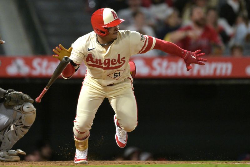 Sep 16, 2024; Anaheim, California, USA;  Los Angeles Angels right fielder Gustavo Campero (51) singles in a run in the seventh inning  against the Chicago White Sox at Angel Stadium. Mandatory Credit: Jayne Kamin-Oncea-Imagn Images