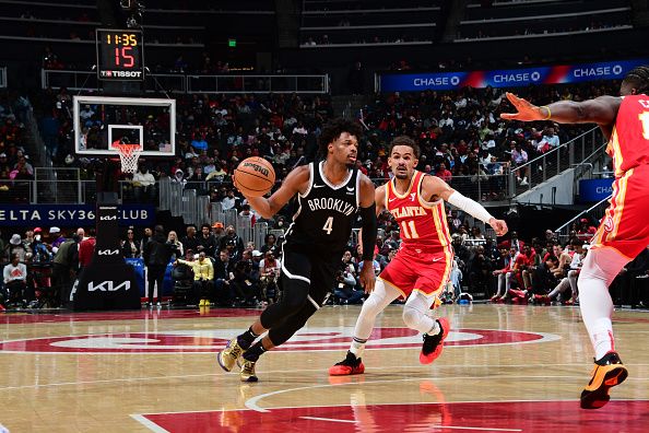 ATLANTA, GA - DECEMBER 6: Dennis Smith Jr. #4 of the Brooklyn Nets dribbles the ball during the game against the Atlanta Hawks on December 6, 2023 at State Farm Arena in Atlanta, Georgia.  NOTE TO USER: User expressly acknowledges and agrees that, by downloading and/or using this Photograph, user is consenting to the terms and conditions of the Getty Images License Agreement. Mandatory Copyright Notice: Copyright 2023 NBAE (Photo by Scott Cunningham/NBAE via Getty Images)