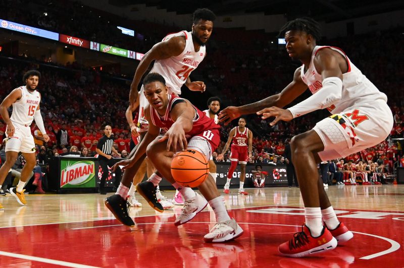 Jan 31, 2023; College Park, Maryland, USA;  Indiana Hoosiers forward Malik Reneau (5) reaches for a loose ball under the basket as Maryland Terrapins guard Hakim Hart (13) and  forward Donta Scott (24) defense during the first half at Xfinity Center. Mandatory Credit: Tommy Gilligan-USA TODAY Sports