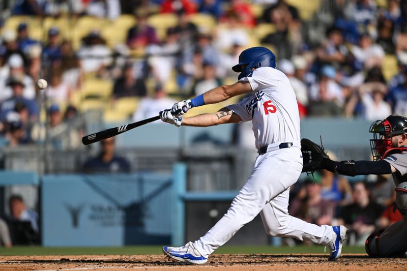 Jul 21, 2024; Los Angeles, California, USA; Los Angeles Dodgers catcher Austin Barnes (15) hits a home run against the Boston Red Sox during the fifth inning at Dodger Stadium. Mandatory Credit: Jonathan Hui-USA TODAY Sports