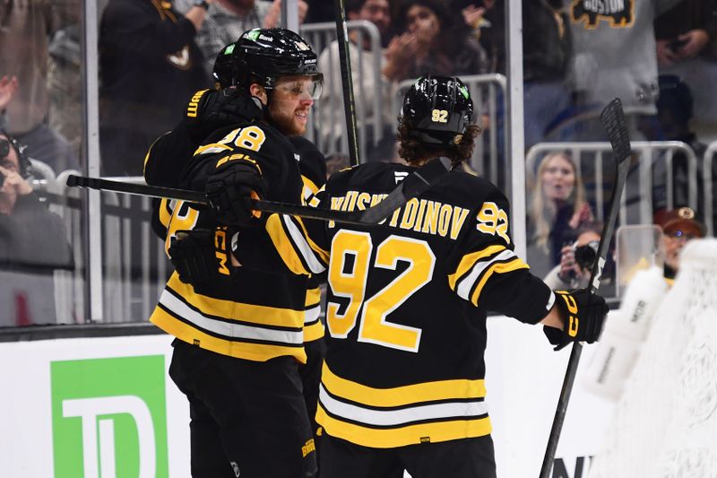Oct 30, 2025; Boston, Massachusetts, USA; Boston Bruins right wing David Pastrnak (88) celebrates his goal with center Marat Khusnutdinov (92) during the first period against the Buffalo Sabres at TD Garden. Mandatory Credit: Bob DeChiara-Imagn Images