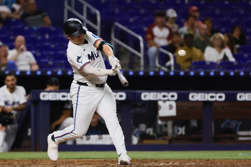 Aug 5, 2024; Miami, Florida, USA; Miami Marlins designated hitter Jonah Bride (41) hits and RBI single against the Cincinnati Reds during the seventh inning at loanDepot Park. Mandatory Credit: Sam Navarro-USA TODAY Sports