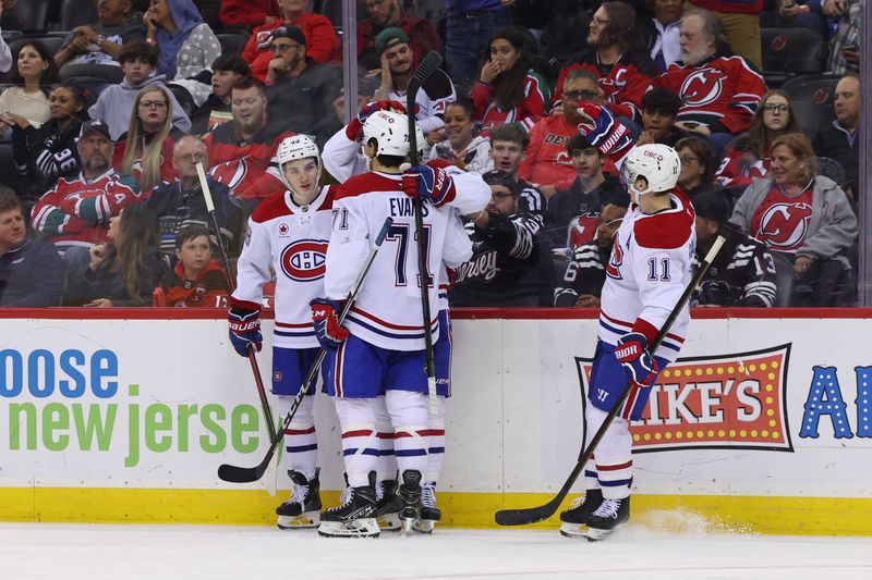 Nov 7, 2024; Newark, New Jersey, USA; Montreal Canadiens center Alex Newhook (15) celebrates his goal against the New Jersey Devils during the third period at Prudential Center. Mandatory Credit: Ed Mulholland-Imagn Images