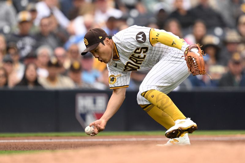 May 17, 2023; San Diego, California, USA; San Diego Padres third baseman Ha-seong Kim (7) cannot field a ball bare-handed hit by Kansas City Royals shortstop Bobby Witt (not pictured) during the fourth inning at Petco Park. Mandatory Credit: Orlando Ramirez-USA TODAY Sports