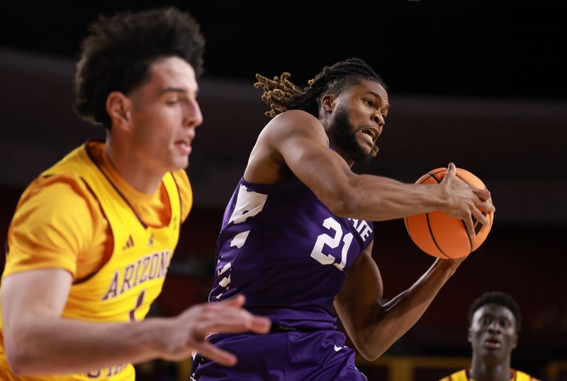 Jan 10, 2026; Tempe, Arizona, USA; Kansas State Wildcats forward Khamari McGriff (21) grabs a rebound against the Arizona State Sun Devils in the second half at Desert Financial Arena. Mandatory Credit: Mark J. Rebilas-Imagn Images